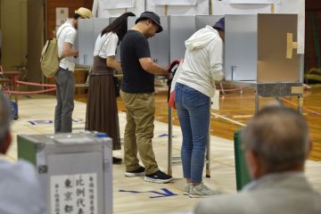 Voters fill out their ballots to vote in Tokyo Voters fill out their ballots to vote in Tokyo to illustrate Sector pessimistic about funding as Japan goes to polls
