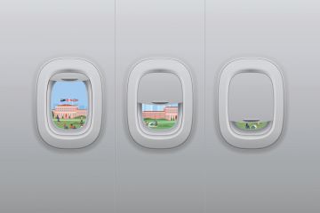 View of buildings from athree plane windows that are closing View from aeroplanes windows closing