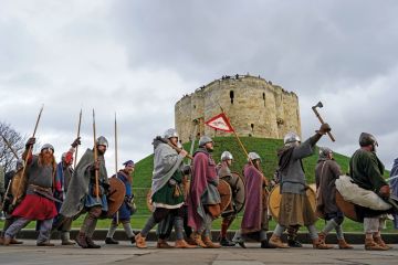 Viking re-enactors march through York to illustrate UK recruitment woes spur new bout of cuts 
