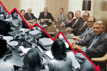 Boardroom meeting divided graph line going down, half black and white half colour to illustrate Faculty-administrator distrust is making US universities ungovernable