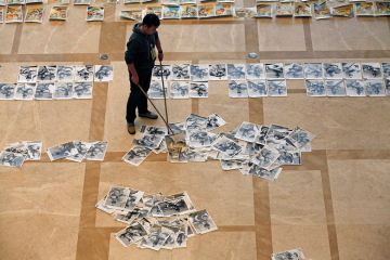 Student's exam papers being swept up from the floor to illustrate China journal crackdown ‘a band-aid rather than a cure’