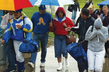 Spectators exit the Woodbridge Softball Classic Tournament which was postponed. Spectators exit the Woodbridge Softball Classic Tournament which was postponed.