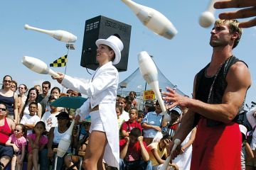 Jugglers perform during Circus Days at Coney Island in the Brooklyn borough of New York City to illustrate Remedial education gets big overhaul in US