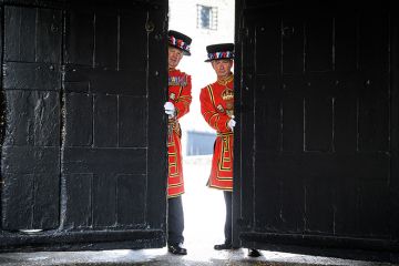 Guards pose with the gates at the main entrance of the Tower of London to illustrate Tories’ manifesto could include a pledge to scrap UK graduate visa