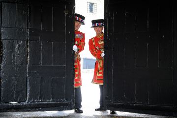 Guards pose with the gates at the main entrance of the Tower of London Guards pose with the gates at the main entrance of the Tower of London to illustrate Tories’ manifesto could include a pledge to scrap UK graduate visa