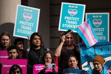 LGBT activists  rally in support of transgender people on the steps of New York City Hall to illustrate Biden turns to transgender rights in discrimination rules redraft