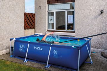 Woman swimming in paddling pool in the garden Woman swimming in paddling pool to illustrate Course closures bring risk of ‘humanities cold spots’
