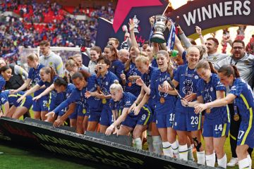 Chelsea celebrate on the podium as the boarding falls down during the Vitality Women's FA Cup Final match Chelsea celebrate on the podium as the boarding falls down during the Vitality Women's FA Cup Final match to illustrate ‘Complacent’ universities stuck on bottom rung of Athena Swan