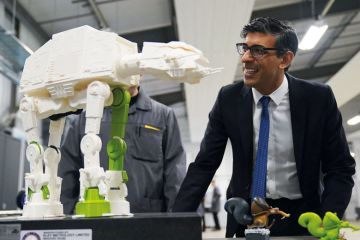 Prime Minister Rishi Sunak looks at a 3-D printed model of an All Terrain Armoured Transport Walker to illustrate Horizon association deal ‘opens door for Pioneer reappraisal’
