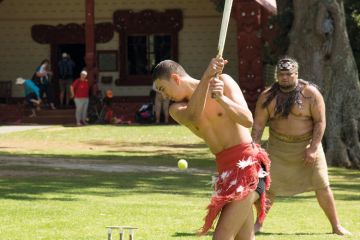 Maori men playing cricket at Waitangi New Zealand Maori men playing cricket at Waitangi New Zealand