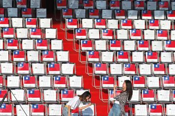 Two people in front of empty seating in Taiwan Two people in front of empty seating in Taiwan to illustrate Scholars doubtful of Taiwan’s international student target