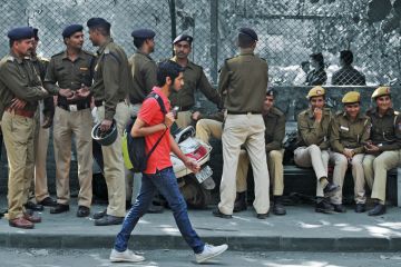 Akhil Bharatiya Vidyarthi Parishad (ABVP) members taking a break at a march from Ramjas College to the Faculty of Arts at Delhi University to illustrate Political interference  on campus is  wasting India’s demographic dividend
