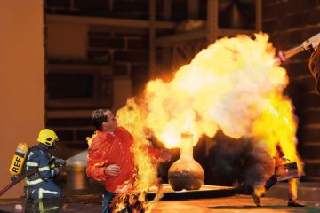 Lab technician setting fire to a ball with a hydrogen blowtorch Lab technician setting fire to a ball with a hydrogen blowtorch to illustrate Can the REF really address the research environment crisis?