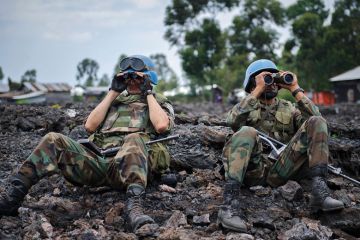 Uruguayan United Nations peacekeepers look through binoculars Uruguayan United Nations peacekeepers look through binoculars to illustrate New rules of engagement