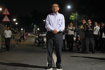Rocky Tuan, vice chancellor of the Chinese University of Hong Kong (CUHK), poses during a photo call for the press as he arrives to meet students and protesters after police fired tear gas earlier during clashes with protesters on campus