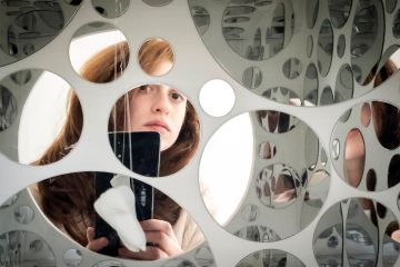  The view from artist Raphaela Frangou's mobile phone as she takes a photograph of herself being reflected by mirrors to illustrate Leeds bans ‘unfairly disparaging’ social media posts