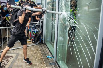 man smash window glass protest_getty.jpg man smash window glass protest_getty.jpg