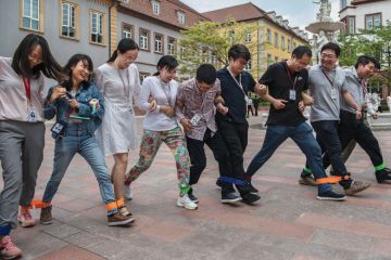 Huawei workers play a 'team building' game at the end of the lunch break at the new sprawling 'Ox Horn' Research and Development campus Huawei workers play a 'team building' game at the end of the lunch break at the new sprawling 'Ox Horn' Research and Development campus