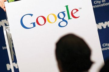 Shadow of person with Google logo Shadow of person with Google logo