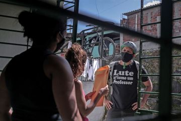 man delivers envelope with a face mask on man delivers envelope with a face mask on