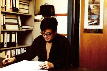 Weimin Wu at work in office, Switzerland