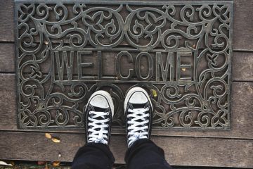 Welcome mat metaphor for scholarships incentive EU students in the UK