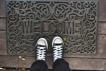 Welcome mat Welcome mat metaphor for scholarships incentive EU students in the UK