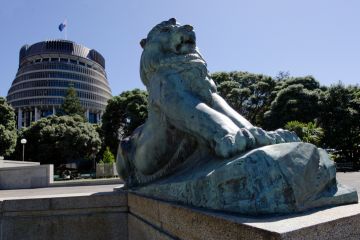 Wellington, New Zealand - February 25, 2013 Lion outside the Beehive building - Parliament of New Zealand in Wellington city as view from Wellington Citizens War Memorial on February 25, 2013. Wellington, New Zealand - February 25, 2013 Lion outside the Beehive building - Parliament of New Zealand in Wellington city as view from Wellington Citizens War Memorial on February 25, 2013.
