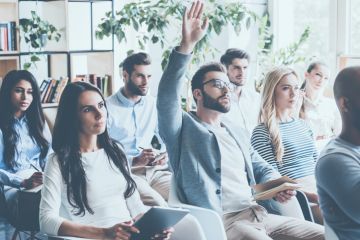 White man with hand up
