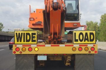 A lorry with a "wide load" sign