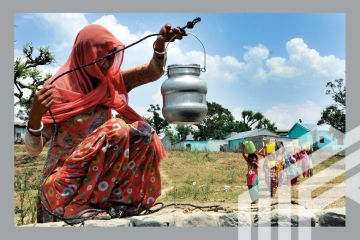 A lady collecting drinking water from an almost dried up well as others come to collect at Padal village of Samba district, around 40 kilometer from Jammu, India. A lady collecting drinking water from an almost dried up well as others come to collect at Padal village of Samba district, around 40 kilometer from Jammu, India.