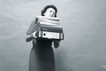 woman carrying files woman carrying files