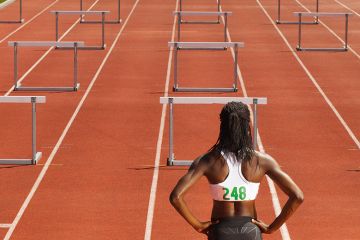 woman in front of hurdles