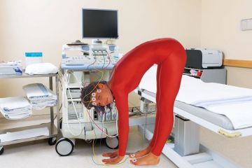 Woman wearing red catsuit Woman wearing red catsuit