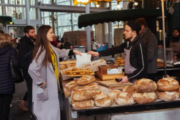 woman buying bread on the Camden Market woman buying bread on the Camden Market