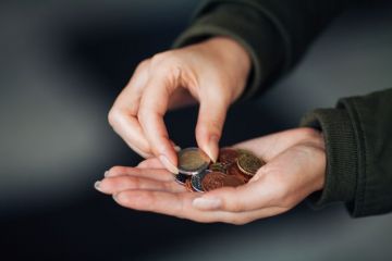 Woman counting euros in hand Woman counting euros in hand