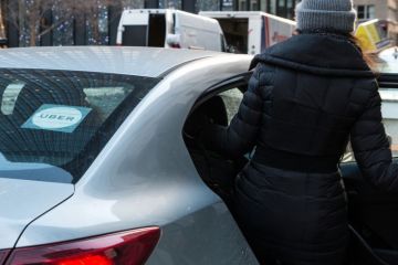 Woman getting into Uber