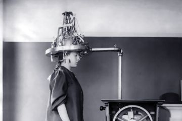 A woman wearing an electronic headset A woman wearing an electronic headset