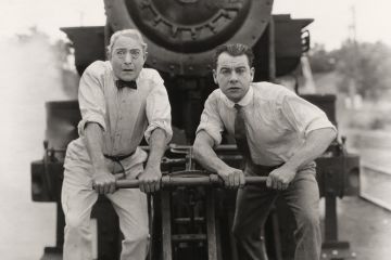 Worried men in front of runaway train