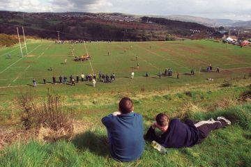 Young men watching rugby match, Cefn coed RFC
