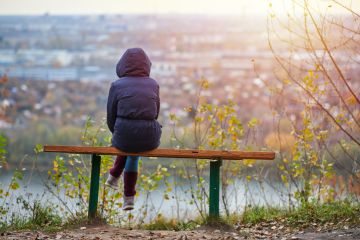 Young woman sitting on bench Young woman sitting on bench