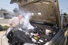 Man with overheating car