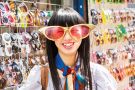 Smiling young woman wearing comedy sunglasses Smiling young woman wearing comedy sunglasses