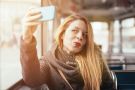 Woman taking selfie photograph with smartphone Woman taking selfie photograph with smartphone