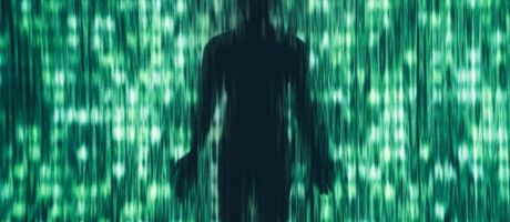 A dark human silhouette stands behind a curtain of vertical green light streaks and digital patterns A dark human silhouette stands behind a curtain of vertical green light streaks and digital patterns