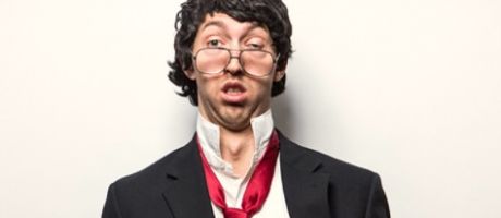 A dishevelled man in a suit