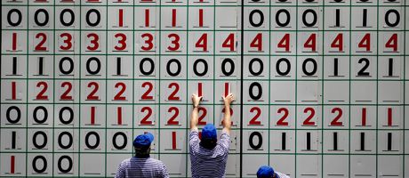 Course volunteers update the main leader board during a golf tournament. To illustrate ‘inconsistency’ fears after REF retreat on environment metrics.