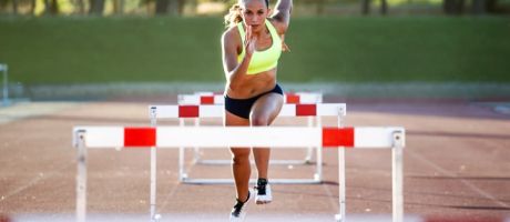 A woman jumping hurdles, illustrating meeting learning outcomes A woman jumping hurdles, illustrating meeting learning outcomes