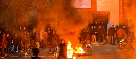Iranian protestors block a street during a protest in Tehran on January 9