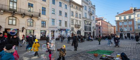 Children playing on a cobblestone street in Ukraine's Lviv